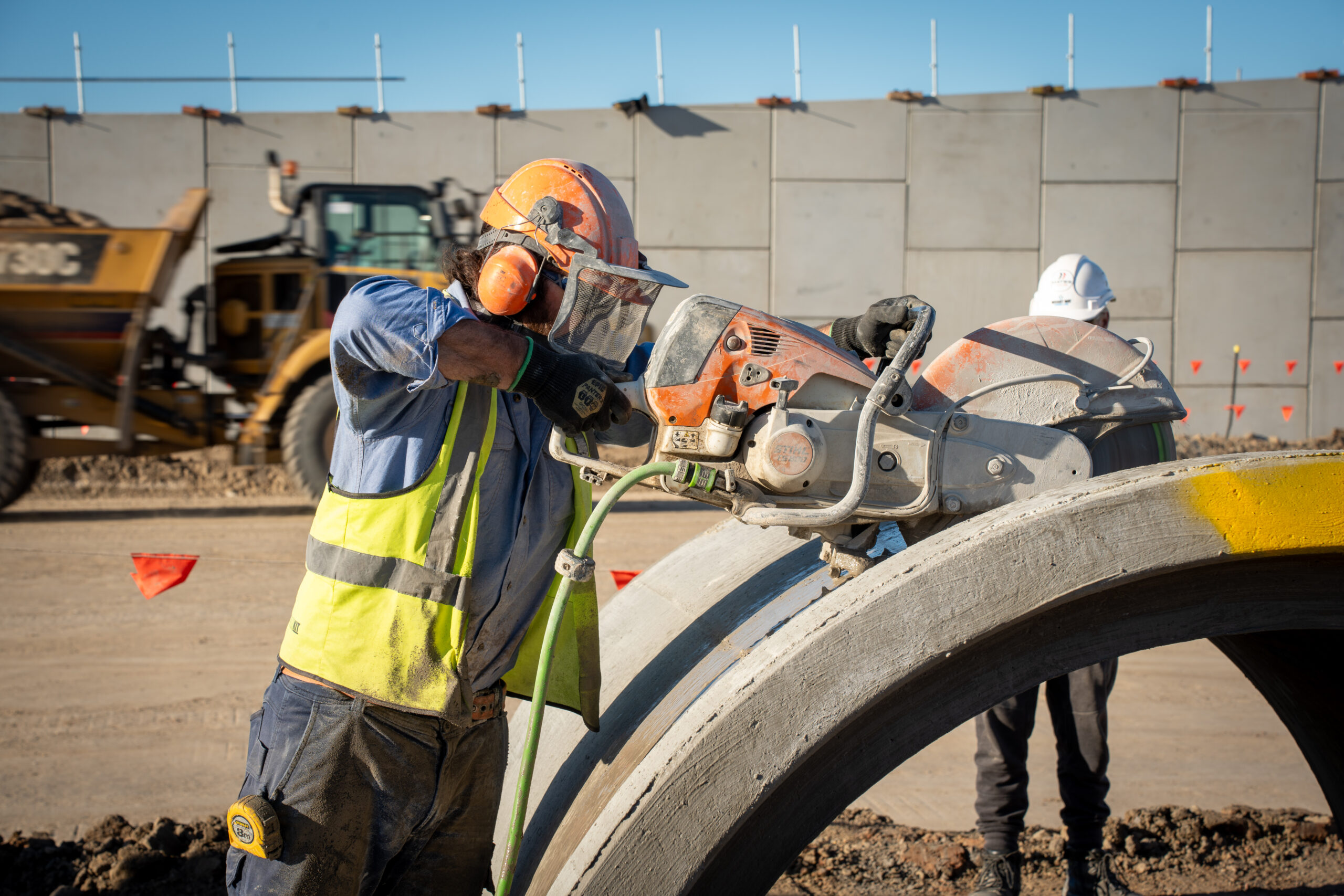 Adam cutting concrete pipe